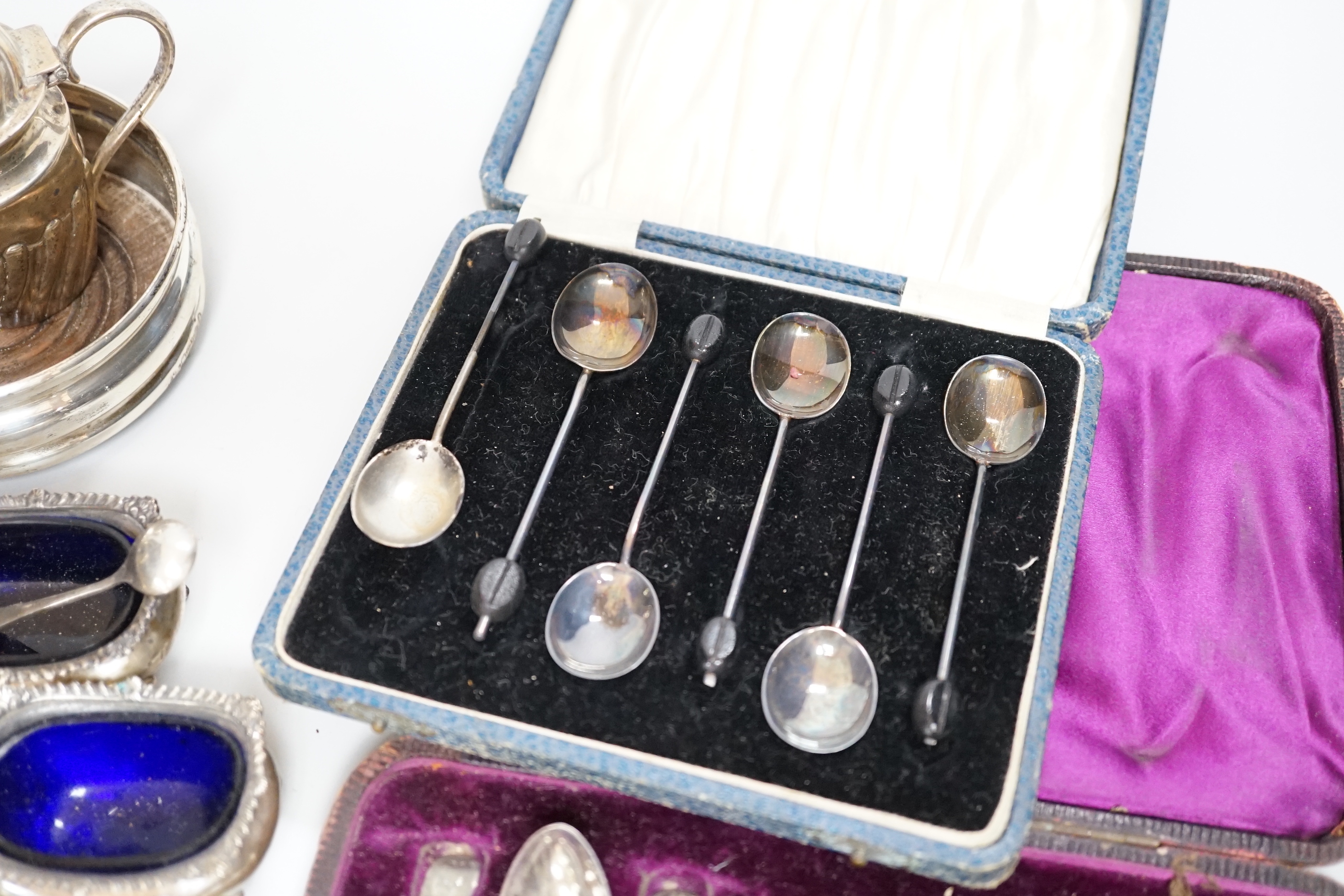 Sundry small silver including two sets of teaspoons, butter dish, coaster condiments and flatware and three white metal finger bowls stamped 'Silver'.